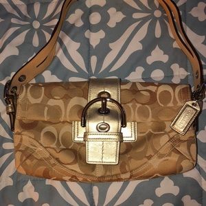 Gently used Coach purse. Comes with duster bag.